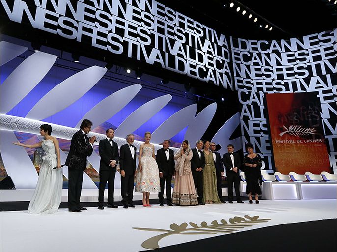 (From L) French actress and mistress of ceremonies at the Cannes Film Festival Audrey Tautou, Indian actor Amitabh Bachchan, US actor Leonardo DiCaprio, US director and President of the Feature Film Jury Steven Spielberg and Jury members Australian actress Nicole Kidman, French actor Daniel Auteuil, Indian actress Vidya Balan, Taiwanese director Ang Lee, Japanese director Naomi Kawase, Austrian actor Christoph Waltz, Romanian director Cristian Mungiu and British director Lynne Ramsay stand on stage on May 15, 2013 during the opening ceremony of the 66th edition of the Cannes Film Festival in Cannes. Cannes, one of the world's top film festivals, opens on May 15 and will climax on May 26 with awards selected by a jury headed this year by Hollywood legend Steven Spielberg. AFP PHOTO / VALERY HACHE