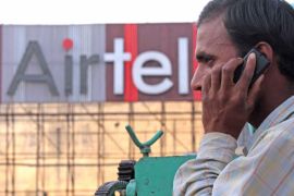 An Indian man talks on his cell phone with an advertisement board of the Bharti Airtel, cellular phone service provider in the backdrop in the northern Indian city of Amritsar, 09 April 2010. India began the auction of the radio frequency spectrum for third-generation (3G) telephony with major cellular phone firms bidding for providing services in the booming telecommunications market, officials said. Top players like Bharti Airtel Ltd and Reliance Communications Ltd were bidding for airwaves in the sale for 22 service areas across the country. EPA/RAMINDER PAL SINGH