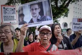 In this file picture taken on June 13, 2013 protesters shout slogans in support of former US spy Edward Snowden as they march to the US consulate in Hong Kong. Hong Kong has risked the threat of US reprisals in allowing Edward Snowden to leave. But its government insists that the rule of law took primacy for a territory that jealously guards its separateness from mainland China. In a press statement confirming the 30-year-old's shock departure on June 23, Hong Kong authorities said the reason was simple: the US government had failed to meet the legal bar needed to justify its arrest warrant issued on June 21.