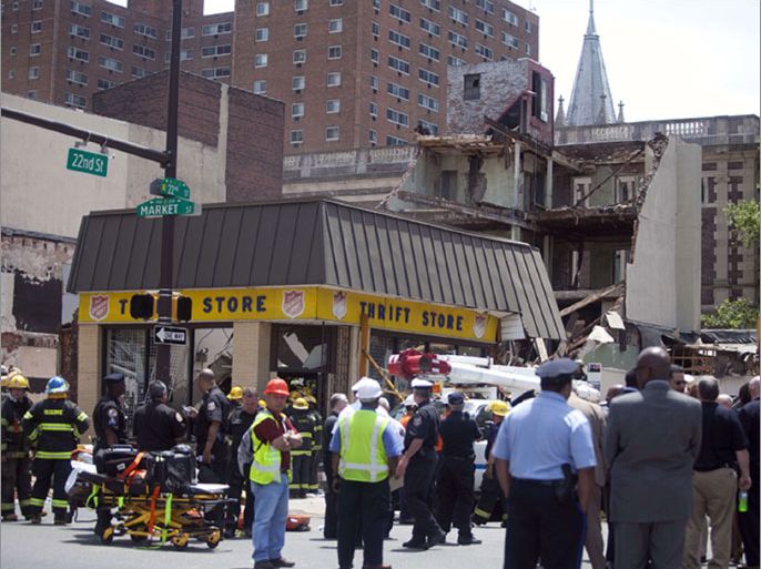 PHILADELPHIA, PA - JUNE 5: Rescue workers search for victims and clear debris from a building that collapsed in an apparent accident at a demolition site, at 22nd and Market Streets, June 5, 2013 in Philadelphia, Pennsylvania.