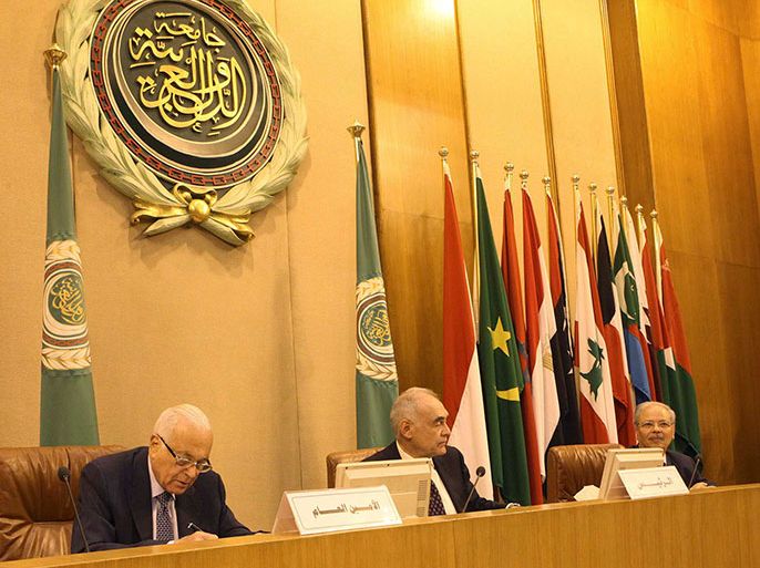 Arab League Secretary-General Nabil al Arabi (L) and Egyptian Foreign Minister Mohamed Kamel Amr (C) attend an Arab foreign ministers meeting on Syria at the Arab League headquarters in Cairo June 5, 2013. REUTERS/Asmaa Waguih (EGYPT - Tags: POLITICS)