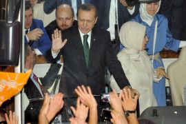 DEC315 - Istanbul, -, TURKEY : Turkish Prime Minister Recep Tayyip Erdogan (L), wife Emne Erdogan (C) and daugther Sumeye Erdogan (R) are greeted by supporters upon arrival at Ataturk International Airport in Istanbul on June 7, 2013.Turkey's Islamic-rooted government apologised to wounded protestors and said it had "learnt its lesson" after days of mass street demonstrations that have posed the biggest challenge to Prime Minister Recep Tayyip Erdogan's decade in office. Turkish police had on June 1 begun pulling out of Istanbul's iconic Taksim Square, after a second day of violent clashes between protesters and police over a controversial development project. What started as an outcry against a local development project has snowballed into widespread anger against what critics say is the government's increasingly conservative and authoritarian agenda. AFP PHOTO / OZAN KOSE