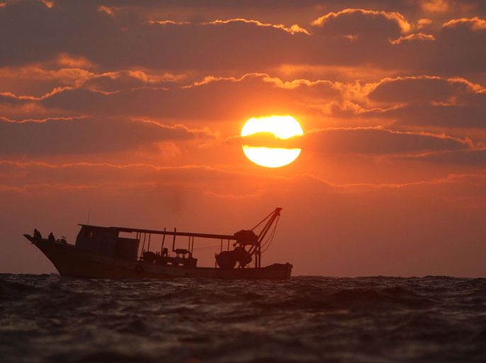 epa02783382 A Palestinian fishing boat as the sun goes down off a beach in the west of Gaza City 17 June 2011. Reports state that during the summer the beach is a major venue for entertainment and leisure in the Gaza Strip. EPA/ALI A