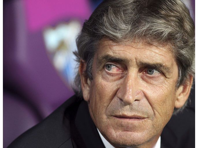 epa03744875 (FILE) A file picture dated 24 October 2012 shows Malaga's Chilean head coach Manuel Pellegrini during the UEFA Champions League Group B soccer match against AC Milan at La Rosaleda stadium in Malaga, southern Spain. English Premier League side Manchester City on 14 June 2013 confirmed the appointment of Manuel Pellegrini as their new manager. The 59-year-old Chilean signed a three-year contract, replacing Roberto Mancini, who left the club two matches before the end of the season. EPA/DANIEL PEREZ