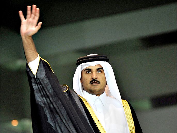epa02130461 Qatar's Crown Prince Sheikh Tamim bin Hamad al-Thani waves as he arrives at Al-Sadd Stadium for the final match of the Crown Prince Cup soccer tournament between Qatari teams Al-Arabi and Al-Gharafa in Doha, Qatar, 24 April 2010. EPA/STRINGER