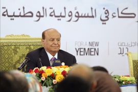 Yemen's President Abd-Rabbu Mansour Hadi smiles during the opening of the second plenary session of the dialogue conference in Sanaa June 8, 2013. REUTERS/Mohamed al-Sayaghi (YEMEN - Tags: POLITICS)