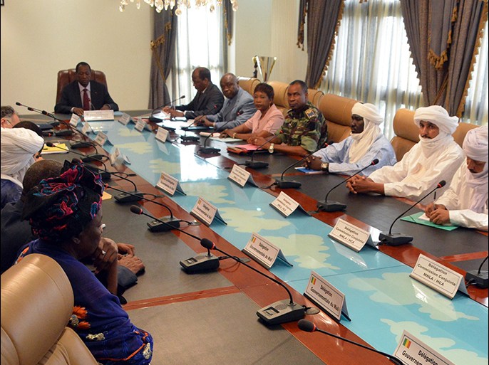 Burkina Faso President Blaise Compaore (L) meets the Bamako and Tuareg delegations in the presence of United Nations, African Union and European Union representatives, on June 10, 2013, at the presidential palace in Ouagadougou. Mali's government has been struggling to reestablish its authority over all of the west African country after a March 2012 coup in Bamako created a power vacuum that saw Al-Qaeda linked Islamists and Tuareg rebels overrun the north. Burkina Faso's mediators hosting talks between Mali's government and armed Tuareg rebels said on June 10 they hoped for an agreement to enable elections to be held next month. AFP