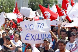 Supporters of Nida Touns (Call of Tunisia), a secular party, chant slogans and hold flags during a demonstration against the immunization law of the revolution, outside the National Constituent Assembly headquarters in Tunis June 29, 2013. REUTERS/Zoubeir Souissi (TUNISIA - Tags: POLITICS CIVIL UNREST)