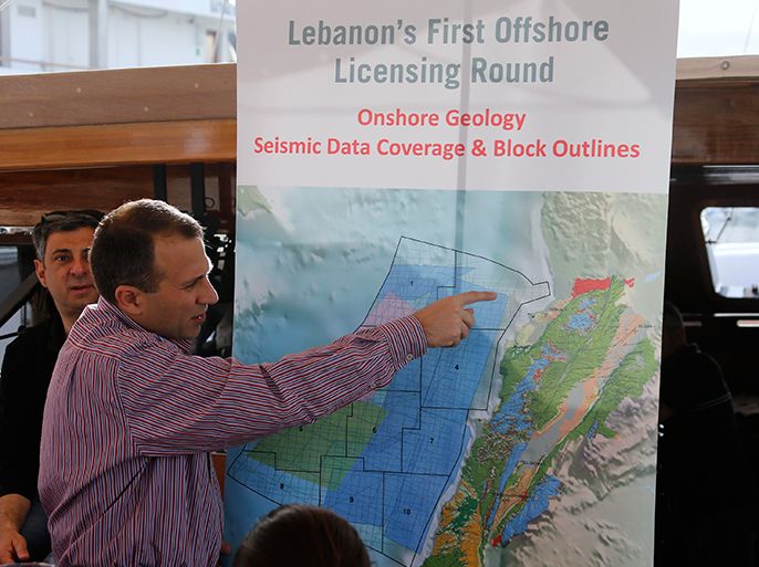Caretaker Energy Minister Gebran Bassil points at a map during a tour of areas believed to have gas reserves, off Lebanon's coast near Beirut May 30, 2013. Offshore seismic surveys suggest Lebanon has at least 30 trillion cubic feet in just a small fraction of its Mediterranean waters Bassil said. Lebanon has selected 46 international oil companies to bid to explore for gas off its coast, where survey ships have been assessing prospects after discoveries in waters off neighbouring Israel and Cyprus. Picture taken May 30, 2013. REUTERS/Mohammed Azakir (LEBANON - Tags: ENVIRONMENT BUSINESS ENERGY COMMODITIES)