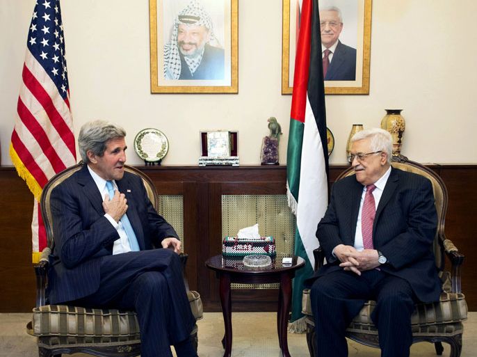 US Secretary of State John Kerry (L) speaks with Palestinian president Mahmud Abbas during a meeting in the Jordanian capital Amman on June 28, 2013. Kerry held a second day of talks aimed at reviving moribund Middle East peace negotiations, sounding out Abbas after talks with Israeli Prime Minister Benjamin Netanyahu in Jerusalem that went on into the night