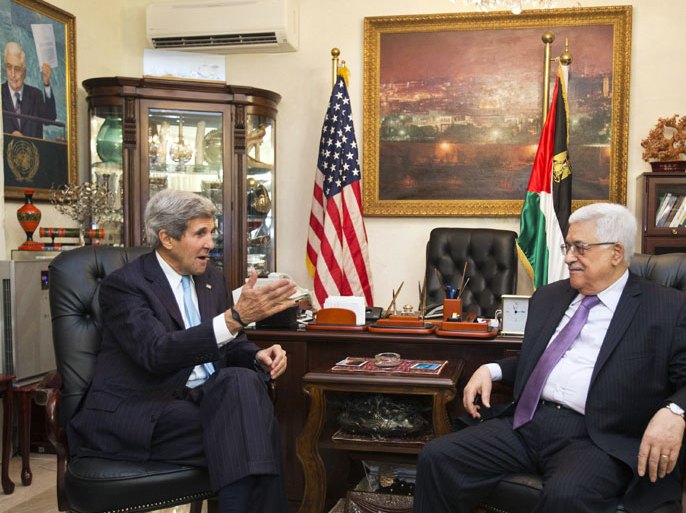 US Secretary of State John Kerry (L) speaks with Palestinian president Mahmud Abbas during a meeting in the Jordanian capital Amman on June 29, 2013. Kerry extended for a third day his shuttle diplomacy between Israeli and Palestinian leaders, raising speculation of progress in reviving long dormant peace talks.