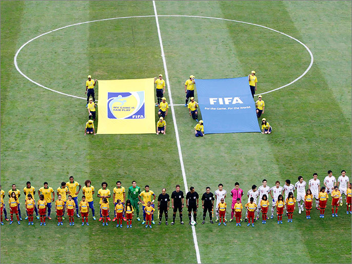 Brazil and Japan players line up before their Confederations Cup Group A soccer match at the Estadio Nacional in Brasilia June 15, 2013. REUTERS/Paulo Whitaker (BRAZIL  - Tags: SPORT SOCCER)
