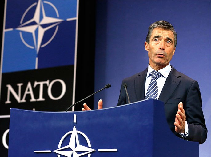 NATO Secretary General Anders Fogh Rasmussen holds a news conference during a NATO defence ministers meeting at the Alliance headquarters in Brussels June 4, 2013. NATO defence ministers concerned about the growing presence of al Qaeda-linked rebels in southern Libya will this week discuss the possibility of training Libyan security forces, U.S. defence officials said on Monday. REUTERS/Yves Herman (BELGIUM - Tags: MILITARY POLITICS)
