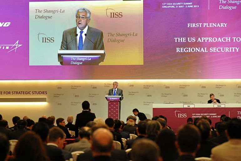 US Defense Secretary Chuck Hagel (back C) speaks at the 12th Shangri-La Dialogue, an Asia Security Summit organised by the Institute for Strategic Studies (IISS) in Singapore on June 1, 2013. US Defense Secretary Chuck Hagel on June 1 accused Beijing of involvement in cyber espionage in a speech at a security forum attended by Chinese military officials. AFP PHOTO / ROSLAN RAHMAN