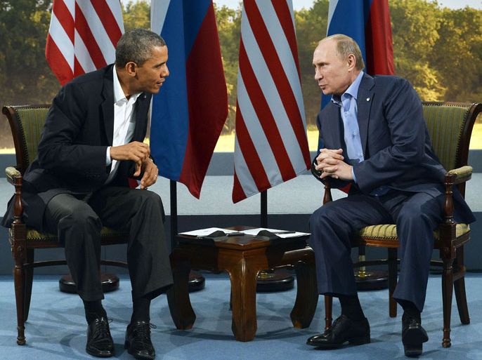 US President Barack Obama (L) holds a bilateral meeting with Russian President Vladimir Putin during the G8 summit at the Lough Erne resort near Enniskillen in Northern Ireland, on June 17, 2013. The conflict in Syria was set to dominate the G8 summit starting in Northern Ireland on Monday, with Western leaders upping pressure on Russia to back away from its support for President Bashar al-Assad. AFP PHOTO / JEWEL SAMAD