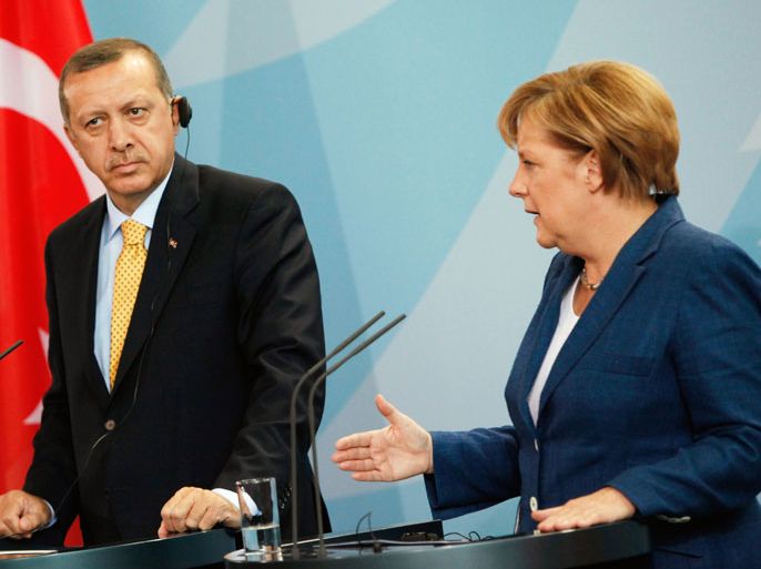 DG033 - Berlin, Berlin, GERMANY : (FILES) - Picture taken on October 9, 2010 shows German Chancellor Angela Merkel and Turkish Prime Minister Recep Tayyip Erdogan addressing a press conference at the chancellory in Berlin. German Chancellor Angela Merkel's conservative party on June 24, 2013 reiterated, in its election programme, its long-standing opposition to Turkey joining the European Union.In comments that came amid heightened tensions between Berlin and Ankara, Merkel also said the goal of a "privileged partnership" between Turkey and the bloc had been reworded because Turkey did not want it. AFP PHOTO / DAVID GANNON