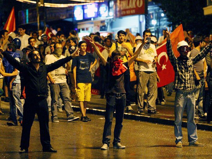 Ankara, Ankara, TURKEY : Protesters shout anti-government slogans during a demonstration in Ankara on June 25 2013. The head of Istanbul's bid to host the 2020 Olympic Games on June 25, 2013 said he was proud of the young protesters who have flooded the streets of Turkish cities in recent weeks and did not think the demonstrations would harm the city's chances of hosting the event. Turkey has taken a tough stance against the tens of thousands of demonstrators who have been protesting since May 31 against the government, which has been seen as increasingly authoritarian and conservative. The protests, which have left at least four people dead and nearly 8,000 injured, have infuriated Prime Minister Recep Tayyip Erdogan, with the heavy-handed government response earning Ankara criticism and raising tensions notably with Germany. AFP PHOTO / ADEM ALTAN