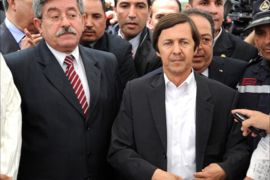 Algerian Prime minister Ahmed Ouyahia (L) and Said Bouteflika (C), brother of Algerian President, attend the funeral of late Algerian singer Warda Al-Jazairia, one of the most famous singers in the Arab world, at the El-Alia cemetery, on May 19, 2012, in Algiers. Algerian singer Warda, whose powerful vocal range and patriotic songs earned her legendary status throughout the Arab world, died of a heart attack in Cairo late on May 17, at the age of 72, her family said. AFP PHOTO / FAROUK BATICHE (Photo credit should read FAROUK BATICHE/AFP/Getty Images)