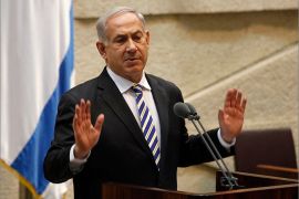 Israeli Prime Minister Benjamin Netanyahu gestures as he delivers a speech on June 5, 2013, at the Knesset, the Israeli parliament in Jerusalem.AFP PHOTO/GALI TIBBON