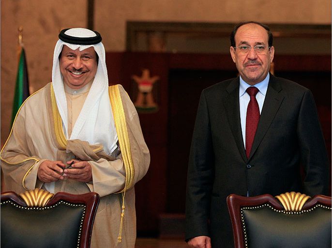 epa03741647 Iraqi Prime Minister Nouri al-Maliki (R) and his Kuwait counterpart Sheikh Jaber Al Mubarak Al Hamad Al Sabah (L) attend a signing ceremony in Baghdad, Iraq, 12 June 2013. Kuwaiti Prime Minister arrived in Baghdad with a high-level delegation on an official visit during which he will have talks with Iraqi officials. The two sides signed a series of agreements aimed at improving bilateral ties in the economic, transportation and other sectors. Kuwaiti Prime Minister arrived in Baghdad with a high-level delegation on an official visit during which he will have talks with Iraqi officials. The two sides signed a series of agreements aimed at improving bilateral ties in the economic, transportation and other sectors. EPA/KARIM KADIM POOL