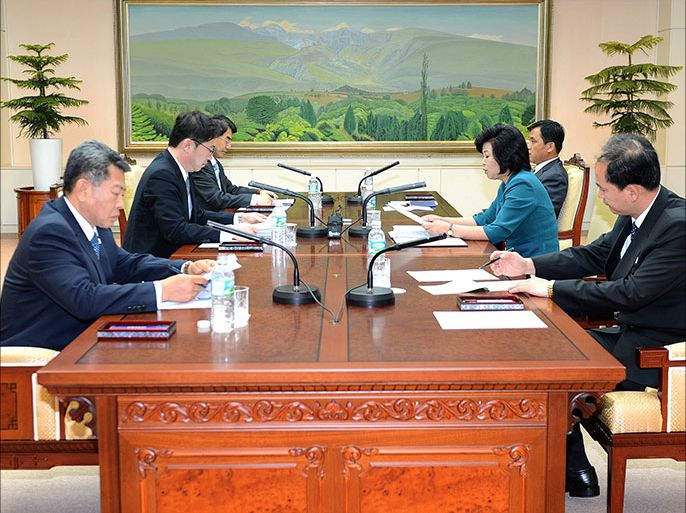 North Korean chief delegate Kim Song-Hye (2nd R) talks with her South Korean counterpart Chun Hae-Sung (2nd L) at the end of the working-level talks at the truce village of Panmunjom in the demilitarized zone dividing the two Koreas on June 10, 2013. North and South Korea reached a patchwork agreement to hold a high-level meeting in Seoul, following marathon talks aimed at rebuilding trust after months of soaring tensions and threats of nuclear war. AFP PHOTO / South Korean Unification Ministry ---- EDITORS NOTE ---- RESTRICTED TO EDITORIAL USE MANDATORY CREDIT "AFP PHOTO / South Korean Unification Ministry" NO MARKETING NO ADVERTISING CAMPAIGNS - DISTRIBUTED AS A SERVICE TO CLIENTS