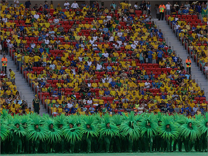 Artists perform during the opening ceremony of the FIFA Confederations Cup Brazil 2013, held before the Group A football match between Brazil and Japan, at the National Stadium in Brasilia on June 15, 2013.  AFP PHOTO / CHRISTOPHE SIMON