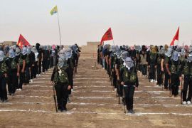 Kurdish opposition fighters attend a ceremony on July 18, 2013, in the northern Syrian border village of al Qamishli. At least 29 people have been killed in fighting between Kurdish and jihadist fighters in northern Syria in the past two days, the Syrian Observatory for Human Rights said.
