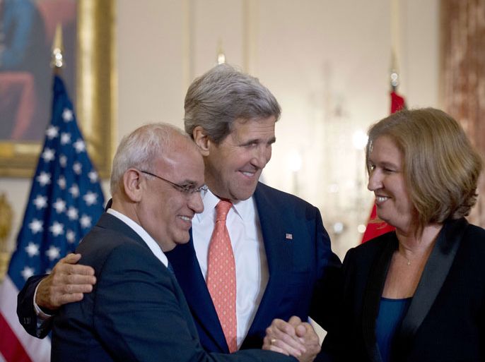 US Secretary of State John Kerry (C) looks on as chief Palestinian negotiator Saeb Erakat (L) and Israel's Justice Minister Tzipi Livni (R) shake hands after speaking at the State Department in Washington on July 30, 2013. Israeli and Palestinian negotiators agreed Tuesday to meet again within the next two weeks, aiming to seal a final peace deal in nine months, Kerry said. The two sides will meet in either Israel or the Palestinian territories and "our objective will be" to reach a "final status agreement over the course of the next nine months," Kerry told reporters after Israelis and Palestinians ended a three-year freeze on talks.