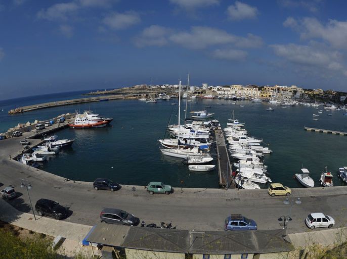 Lampedusa, -, ITALY : This picture shows a general view of the port of Lampedusa island on July 9, 2013 a day after the visit by Pope Francis . Hundreds of migrants were intercepted by Italian, Libyan and Maltese border guards the same day on several boats leaving from Liby