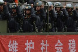 •	Caption:Chinese paramilitary police ride in trucks during a 'show of force' ceremony in Urumqi after a series of terrorist attacks recently hit Xinjiang Province, on June 29, 2013. Armoured vehicles, personnel carriers and other support vehicles blocked access to streets in Xinjiang's capital Urumqi, where paramilitary units carried out an exercise. The exercises come ahead of the fourth anniversary on July 5 of riots, between members of China's mostly Muslim Uighur ethnic minority and the Han majority group, which left around 200 dead.