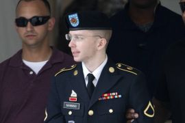 U.S. Army Pfc. Bradley Manning is escorted out of a courthouse at Fort Meade in Maryland, July 18, 2013. The military judge hearing the court-martial of Manning, a U.S. soldier accused of the biggest leak of classified material in the nation's history, refused on Thursday to dismiss the most severe charge the defendant faces, aiding the enemy. That is one of 21 counts that Manning is charged with, but it carries the possibility of life in prison.