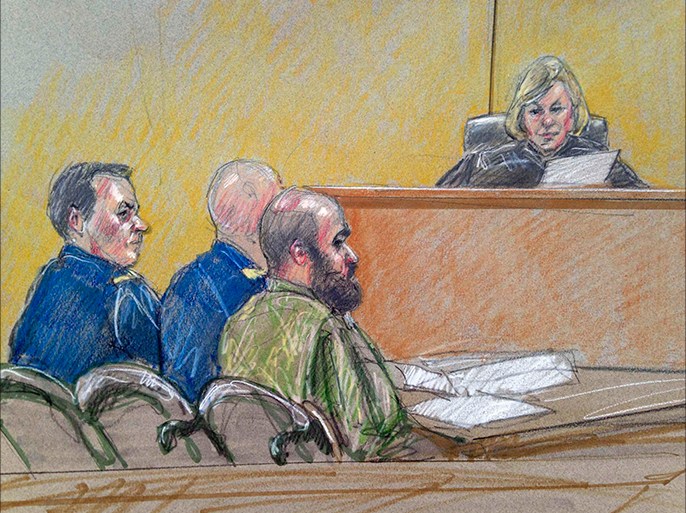 U.S. Army Major Nidal Hasan (C), accused of killing 13 soldiers in a 2009 Fort Hood shooting rampage, is seen in a courtroom sketch as he sits with his legal team in front of military judge Colonel Tara Osborn at his court martial at Fort Hood, Texas July 9, 2013. Hasan, 42, an American-born Muslim who faces the death penalty if convicted by a military panel. REUTERS/Brigitte Woosley (UNITED STATES - Tags: CRIME LAW MILITARY)
