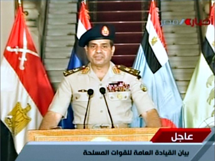 An image grab taken from Egyptian state TV shows Egyptian Defence Minister Abdelfatah al-Sissi delivering a statement on July 3, 2013 as the army unveils a roadmap for Egypt's political future, with state media reporting that the plan sets a tight schedule for new elections. A top aide to Egypt's President Mohamed Morsi slammed what he called a "military coup" as an army ultimatum passed and the security forces slapped a travel ban on the Islamist leader AFP PHOTO/EGYPTIAN TV == RESTRICTED TO EDITORIAL USE - MANDATORY CREDIT "AFP PHOTO / EGYPTIAN TV" - NO MARKETING NO ADVERTISING CAMPAIGNS - DISTRIBUTED AS A SERVICE TO CLIENTS ===