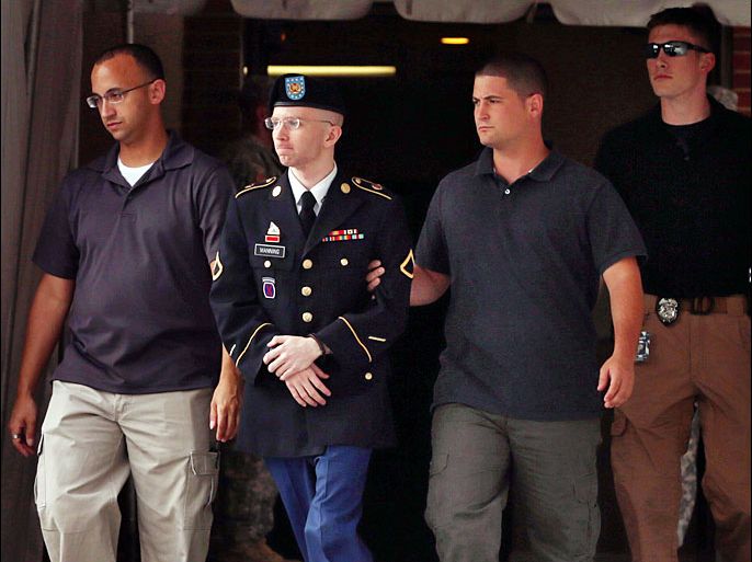 U.S. Army Private First Class Bradley Manning (2nd L) is escorted by military police as he leaves after the first day of closing arguments in his military trial July 25, 2013 Fort George G. Meade, Maryland. Manning, who is charged with aiding the enemy and wrongfully causing intelligence to be published on the internet, is accused of sending hundreds of thousands of classified Iraq and Afghanistan war logs and more than 250,000 diplomatic cables to the website WikiLeaks while he was working as an intelligence analyst in Baghdad in 2009 and 2010. Chip Somodevilla/Getty Images/AFP== FOR NEWSPAPERS, INTERNET, TELCOS & TELEVISION USE ONLY ==