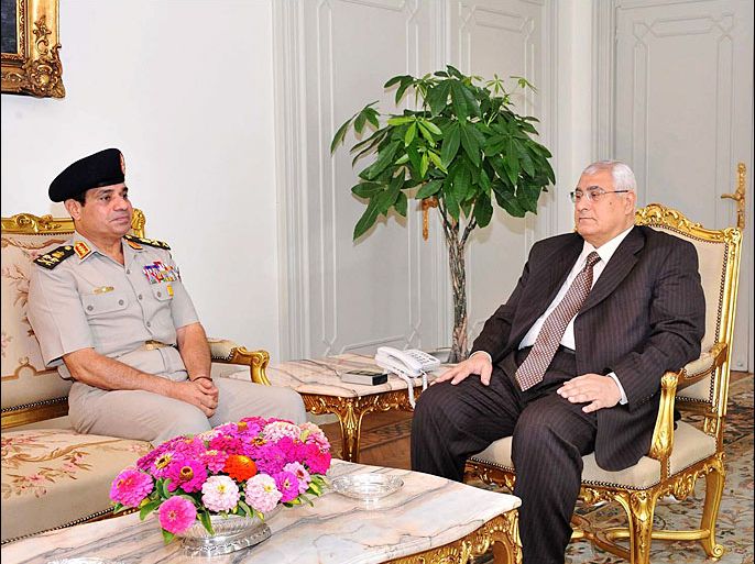 A handout picture released by the Egyptian Presidency shows Egypt's interim president Adly Mansour (R) meeting with Defence minister Abdelfatah al-Sisias on July 6, 2013 in Cairo. Mansour on July 5, 2013 ordered the dissolution of the Shura Council, the country's Islamist-led legislative assembly, according to the official MENA state news agency. AFP PHOTO / EGYPTIAN PRESIDENCY