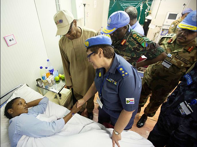 epa03788232 A handout photograph made available by the United Nations - African Union Mission in Darfur (UNAMID) shows a UNAMID police woman, based in Khor Abeche, South Darfur, recovering in the UNAMID hospital in Nyala from the injuries suffered in an ambush a day earlier, in Khor Abeche, South Darfur, 14 July 2013. Seven peacekeepers were killed and 17 military and Police personnel, among them two female Police Advisers, were wounded, in the attack. The incident occurred approximately 25 kilometers west of the Mission's Khor Abeche team site. EPA/ALBERT GONZALEZ FARRAN/UNAMID/HANDOUT HANDOUT EDITORIAL USE ONLY/NO SALES