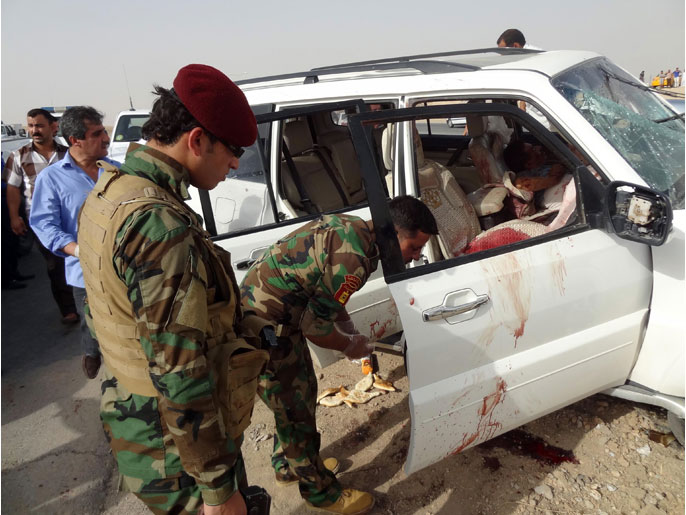 سيارة عبد الله سامي العاصي بعد استهدافها من قبل مسلحين ومقتله (الفرنسية)