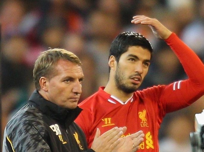 MELBOURNE, AUSTRALIA - JULY 24: Liverpool FC Manager Brendan Rodgers (L) looks on as Luis Suarez of Liverpool is substituted into the match during the match between the Melbourne Victory and Liverpool at the Melbourne Cricket Ground on July 24, 2013 in Melbourne, Australia.