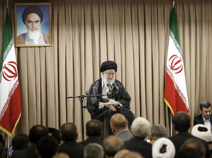 A handout picture released by the official website of the Iranian supreme leader Ayatollah Ali Khamenei (C) shows him speaking during a meeting with Iranian officials in the presence of Iranian outgoing President Mahmoud Ahmadinejad (R) at his office in Tehran on July 21, 2013. AFP PHOTO/HO/KHAMENEI.IR