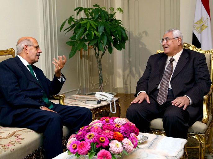A handout picture released by the Egyptian Presidency shows Egypt's interim president Adly Mansour (R) meeting with newly appointed Prime Minister and opposition National Salvation Front leader Mohamed El Baradei (L) in Cairo on July 6, 2013. Liberal leader Mohamed ElBaradei has been chosen as Egypt's new prime minister, the Tamarod campaign behind protests that toppled Islamist president Mohamed Morsi said after talks with the country's interim president. AFP PHOTO / EGYPTIAN PRESIDENCY