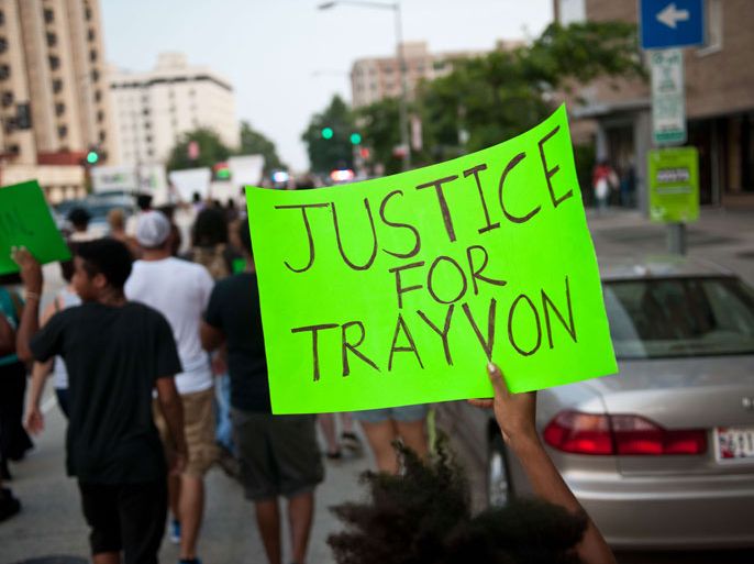 People march in Washington on July 19, 2013 during a demonstration against the acquittal of George Zimmermann in the killing of unarmed Florida teen Trayvon Martin. The Martin case pitted people who thought Zimmerman, 29, -- son of a white father and a Peruvian mother -- killed Martin, 17, in self-defense last February, against others who considered it a racially-motivated killing