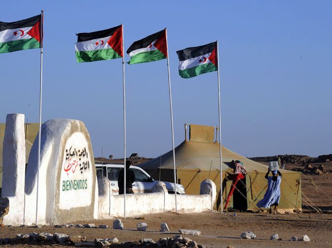 TIFARITI, -, ALGERIA : (FILES) A picture taken on February 28, 2011 in the Western Sahara village of Tifariti shows Saharawis flags blowing in the wind. Morocco's King Mohammed VI said that Algeria has responsabilities and evoks "other parties obstinacy" to explain the statu quo in the disputed territory. Morocco started occupying Western Sahara in 1975 after Spain withdrew. AFP PHOTO / DOMINIQUE fAGET