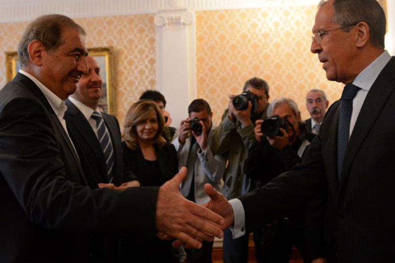 KUD727 - Moscow, -, RUSSIAN FEDERATION : Russian Foreign Minister Sergei Lavrov (R) shakes hands with Syrian deputy Prime Minister Qadri Jamil during their meeting in Moscow, on July 22, 2013. AFP PHOTO/ KIRILL KUDRYAVTSEV