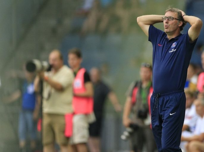 Paris Saint-Germain's head coach Laurent Blanc (R) reacts during a friendly football game in Graz, some 200km south of the Austrian capital on July 9, 2013, as part of the PSG's pre-season training camp in Austria.