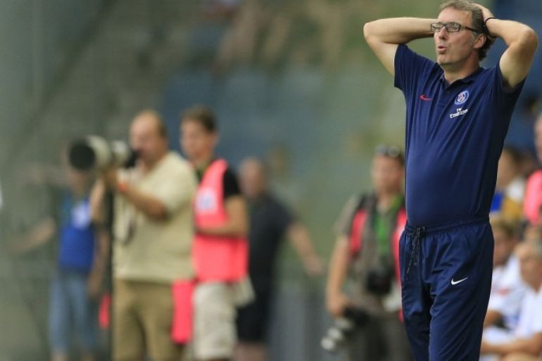 Paris Saint-Germain's head coach Laurent Blanc (R) reacts during a friendly football game in Graz, some 200km south of the Austrian capital on July 9, 2013, as part of the PSG's pre-season training camp in Austria.