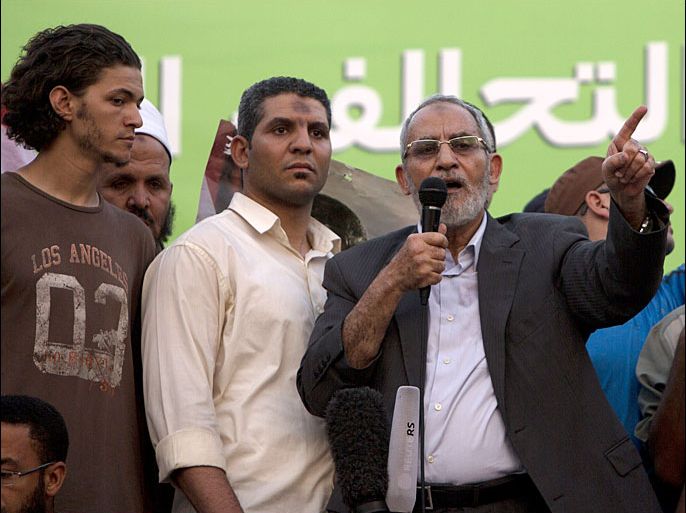 Mohammed Badie (C), supreme guide of Egypt's Muslim Brotherhood, addresses supporters in Cairo on July 5, 2013. Clashes erupted across Egypt between supporters and opponents of deposed president Mohamed Morsi, the official MENA news agency reported, after deadly confrontations between the toppled Islamist's backers and security forces. AFP PHOTO/MAHMUD HAMS