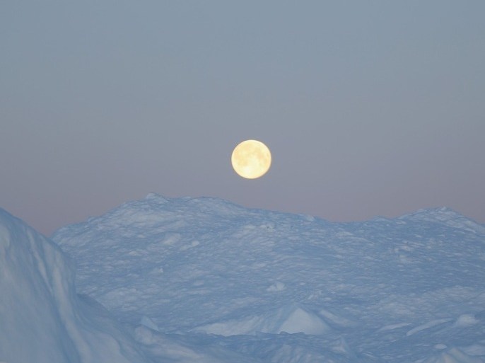 ILULISSAT, GREENLAND - JULY 23: A full moon is seen over an iceberg that broke off from the Jakobshavn Glacier on July 23, 2013 in Ilulissat, Greenland. As the sea levels around the globe rise, researchers affilitated with the National Science Foundation and other organizations are studying the phenomena of the melting glaciers and its long-term ramifications. The warmer temperatures that have had an effect on the glaciers in Greenland also have altered the ways in which the local populace farm, fish, hunt and even travel across land. In recent years, sea level rise in places such as Miami Beach has led to increased street flooding and prompted leaders such as New York City Mayor Michael Bloomberg to propose a $19.5 billion plan to boost the citys capacity to withstand future extreme weather events by, among other things, devising mechanisms to withstand flooding.