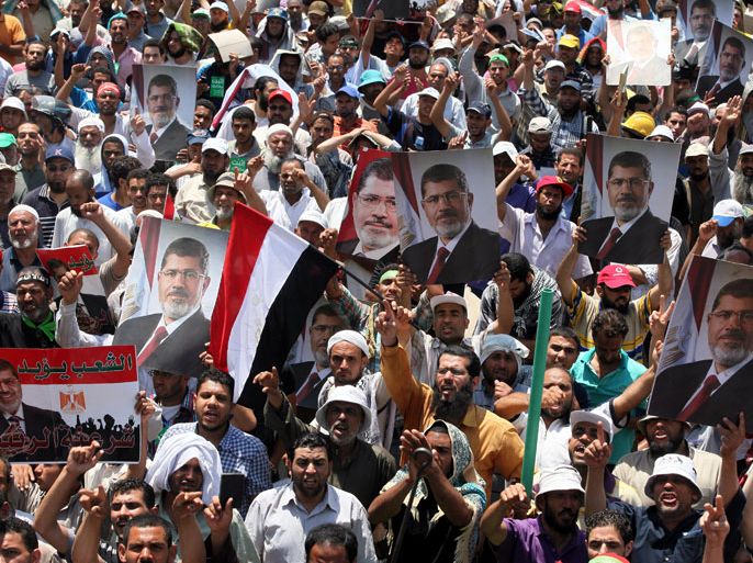epa03774848 Supporters of ousted President Mohamed Morsi gather as they protest near Rabaa Adawiya mosque, in Cairo, Egypt, 04 July 2013. Adli Mansour, the chief of Egypt's highest court, was on 04 July sworn in as Egypt's interim president. Mansour took the oath before the Supreme Constitutional Court, one day after the ousting of Islamist President Mohamed Morsi following days of massive protests. EPA/KHALED ELFIQI EPA/KHALED ELFIQI