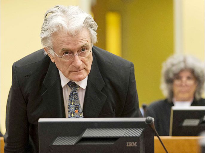 epa03784085 Bosnian Serb wartime leader Radovan Karadzic appears in the courtroom for his appeals judgement at the International Criminal Tribunal for Former Yugoslavia (ICTY) in The Hague, The Netherlands, 11 July 11 2013. EPA/Michael Kooren