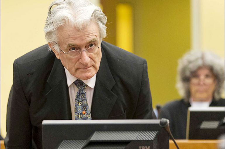 epa03784085 Bosnian Serb wartime leader Radovan Karadzic appears in the courtroom for his appeals judgement at the International Criminal Tribunal for Former Yugoslavia (ICTY) in The Hague, The Netherlands, 11 July 11 2013. EPA/Michael Kooren